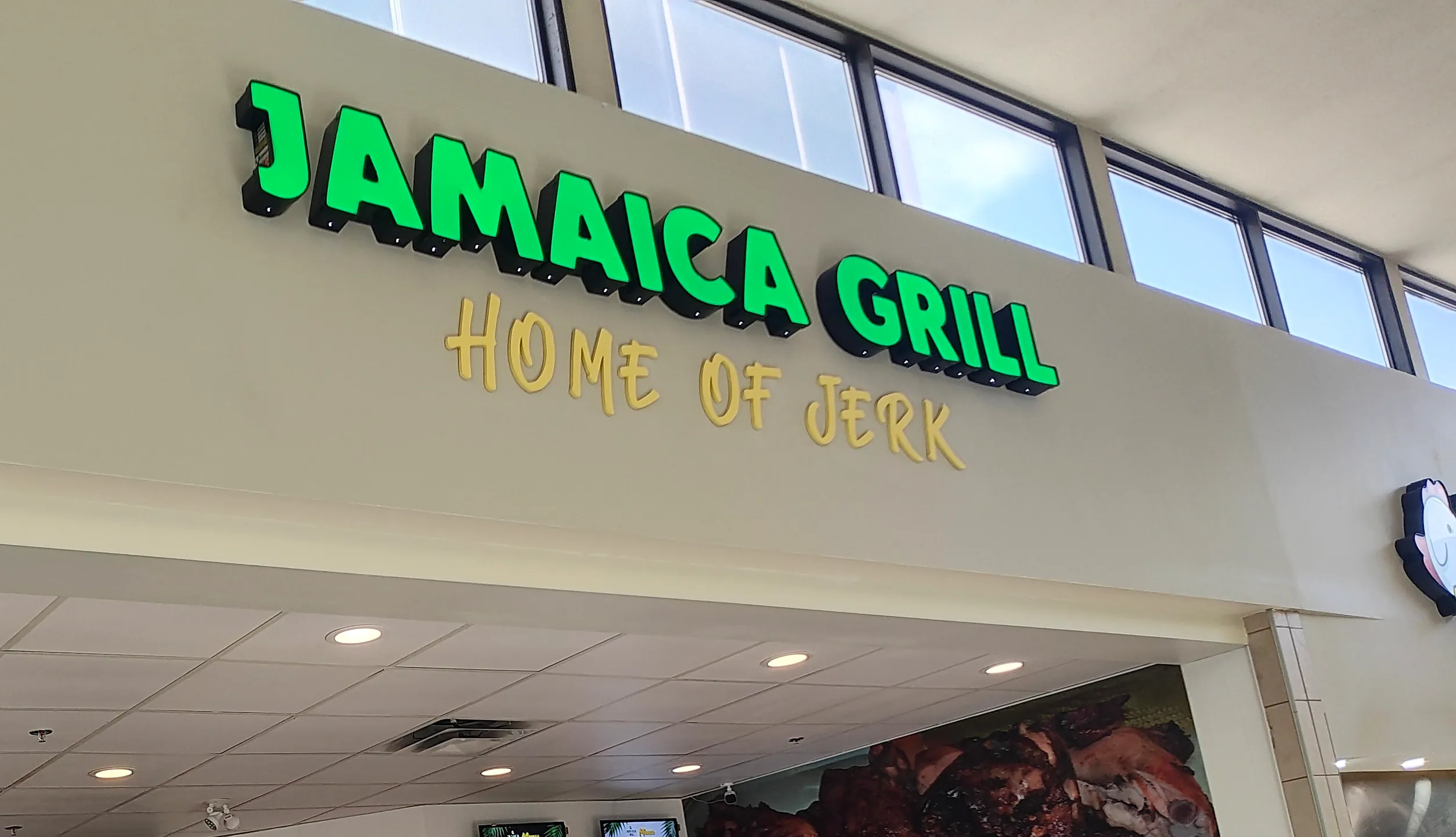 Jamaica Grill Home of Jerk sign at Marlborough Mall