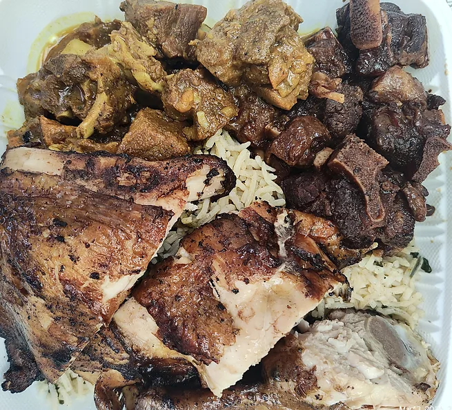 Jerk chicken, oxtail and curry goat over rice